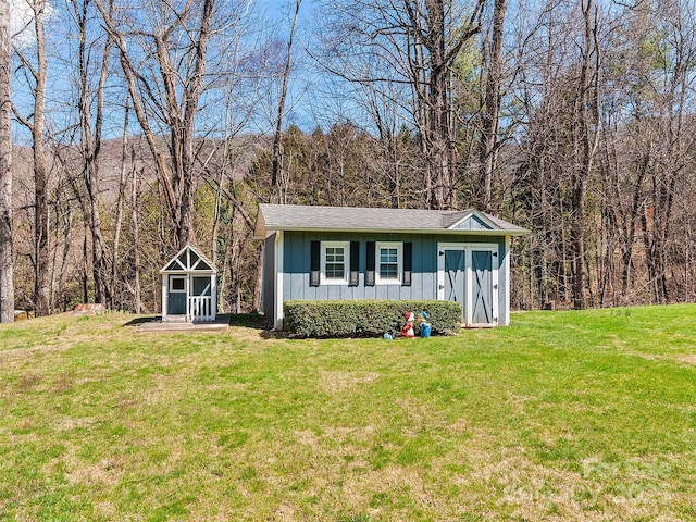 195 Nature Ln, Waynesville, NC 28786 - view of outdoor structure featuring an outbuilding and a view of trees