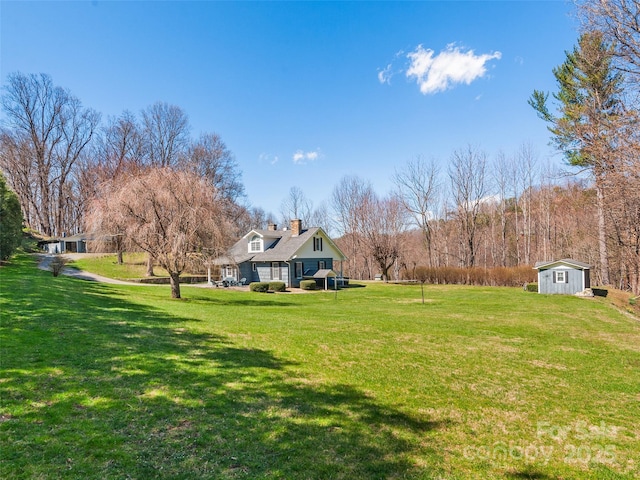 195 Nature Ln, Waynesville, NC 28786 - view of yard featuring an outbuilding and a storage shed