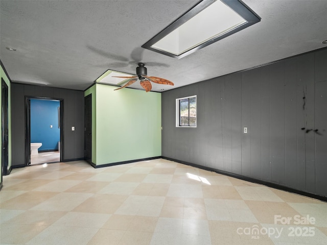 195 Nature Ln, Waynesville, NC 28786 - spare room featuring baseboards, ceiling fan, light floors, and a textured ceiling