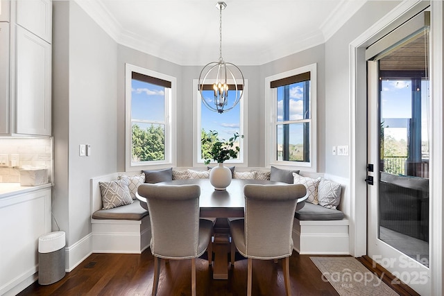 1311 Sunnys Halo Ln, Waxhaw, NC 28173 - dining space featuring breakfast area, a chandelier, plenty of natural light, dark wood-style floors, and ornamental molding