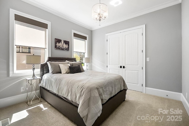 1311 Sunnys Halo Ln, Waxhaw, NC 28173 - carpeted bedroom with a chandelier, a closet, and ornamental molding