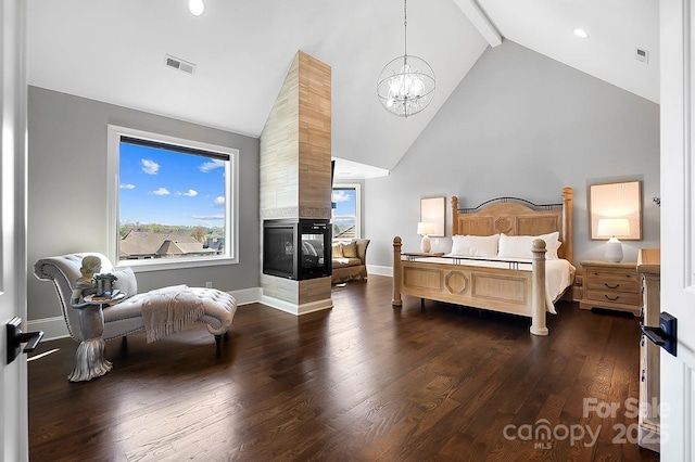 1311 Sunnys Halo Ln, Waxhaw, NC 28173 - bedroom featuring high vaulted ceiling, dark wood-style floors, a chandelier, a multi sided fireplace, and multiple windows