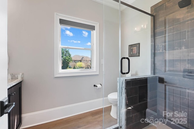 1311 Sunnys Halo Ln, Waxhaw, NC 28173 - full bathroom with a stall shower, vanity, wood finished floors, and ornamental molding