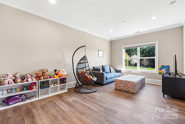 1311 Sunnys Halo Ln, Waxhaw, NC 28173 - living area with wood finished floors, ornamental molding, and recessed lighting