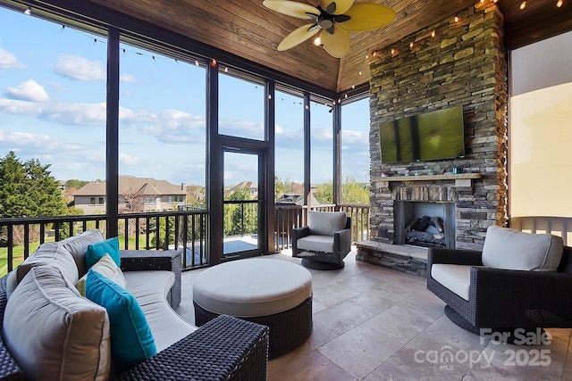 1311 Sunnys Halo Ln, Waxhaw, NC 28173 - sunroom / solarium with an outdoor living space with a fireplace, a ceiling fan, and healthy amount of natural light