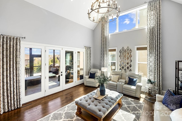 1311 Sunnys Halo Ln, Waxhaw, NC 28173 - living area with high vaulted ceiling, french doors, a chandelier, healthy amount of natural light, and wood finished floors