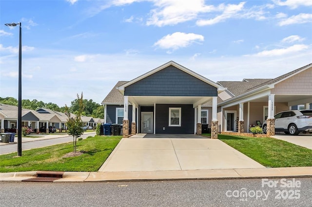 1528 28th Street Pl SE, Hickory, NC 28602 - view of front facade with driveway, a front yard, and an attached carport