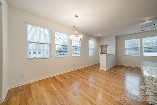 9001 Lanark Ln, Indian Land, SC 29707 - unfurnished dining area featuring light wood finished floors, a chandelier, and baseboards