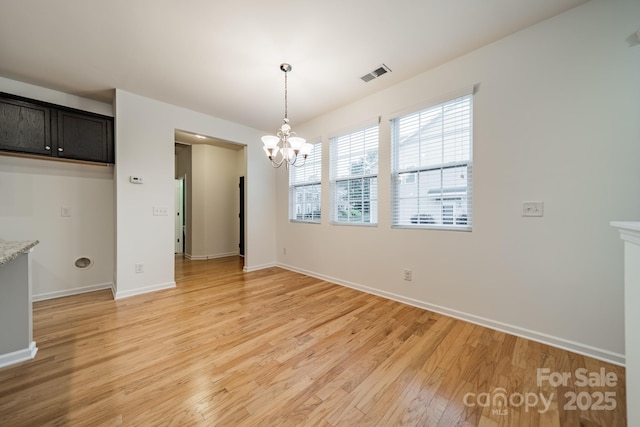 9001 Lanark Ln, Indian Land, SC 29707 - unfurnished dining area featuring a chandelier, light wood-style flooring, and baseboards
