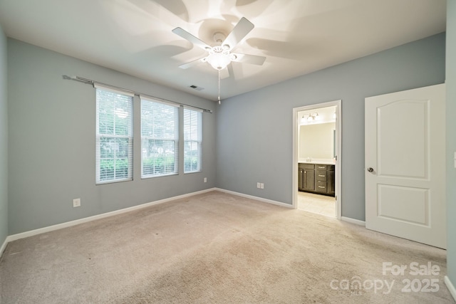 9001 Lanark Ln, Indian Land, SC 29707 - unfurnished bedroom featuring light colored carpet, baseboards, ensuite bathroom, and a ceiling fan
