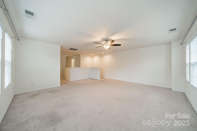9001 Lanark Ln, Indian Land, SC 29707 - spare room featuring light carpet, baseboards, and a ceiling fan