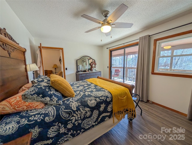 bedroom featuring a textured ceiling, baseboards, wood finished floors, a ceiling fan, and access to exterior