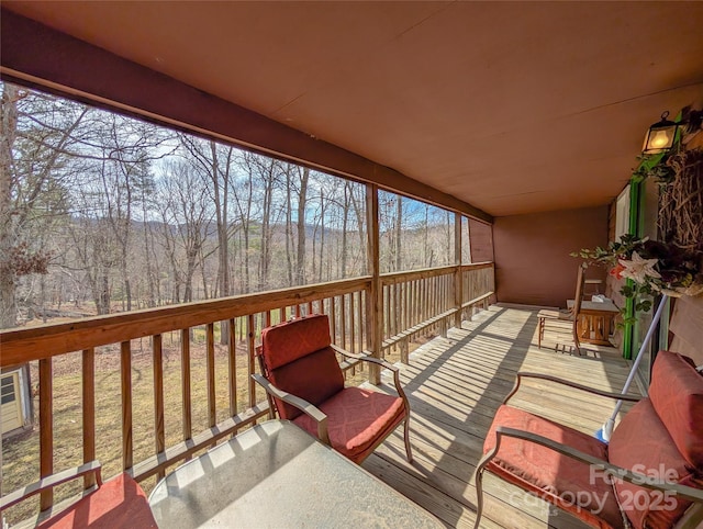 deck featuring a view of trees