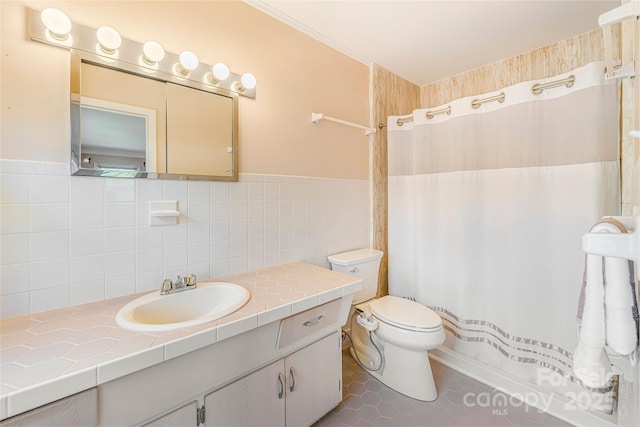 full bathroom featuring a shower with curtain, tile walls, toilet, vanity, and tile patterned floors