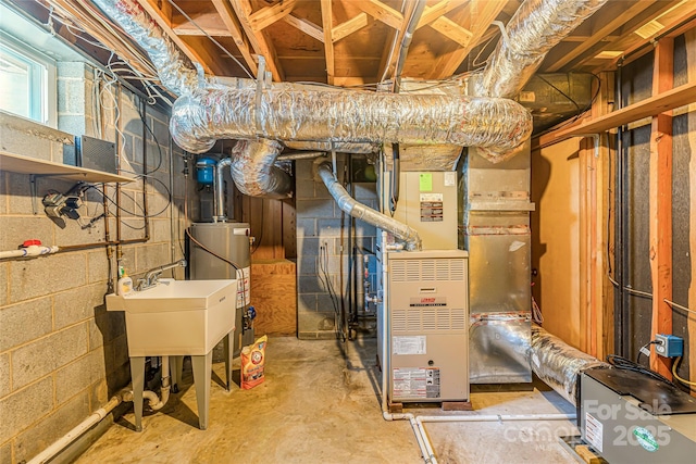 below grade area featuring water heater and heating unit