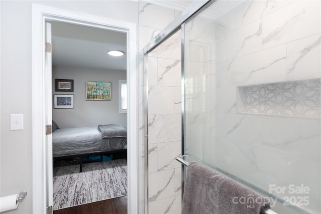 2408 Dora Dr, Charlotte, NC 28215 - ensuite bathroom featuring a tile shower and wood finished floors
