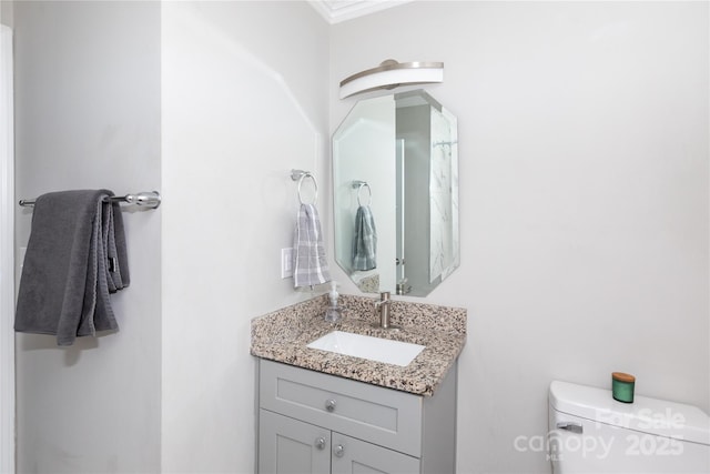 2408 Dora Dr, Charlotte, NC 28215 - bathroom with toilet, vanity, and ornamental molding