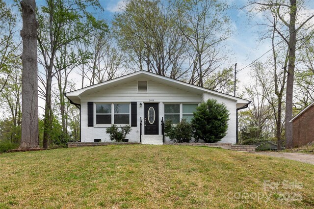 2408 Dora Dr, Charlotte, NC 28215 - view of front of home featuring brick siding and a front yard