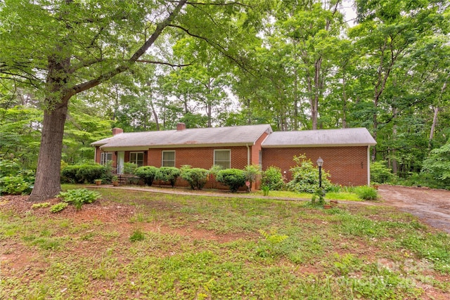 235 John Rainey Rd, Salisbury, NC 28147 - ranch-style house featuring a chimney and brick siding