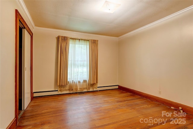 235 John Rainey Rd, Salisbury, NC 28147 - unfurnished room featuring light wood-style floors, crown molding, and baseboards