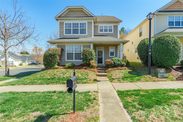 7554 Coastal Way, Huntersville, NC 28078 - view of front facade featuring covered porch and a front lawn