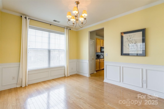 7554 Coastal Way, Huntersville, NC 28078 - unfurnished dining area with visible vents, an inviting chandelier, light wood-style floors, and crown molding