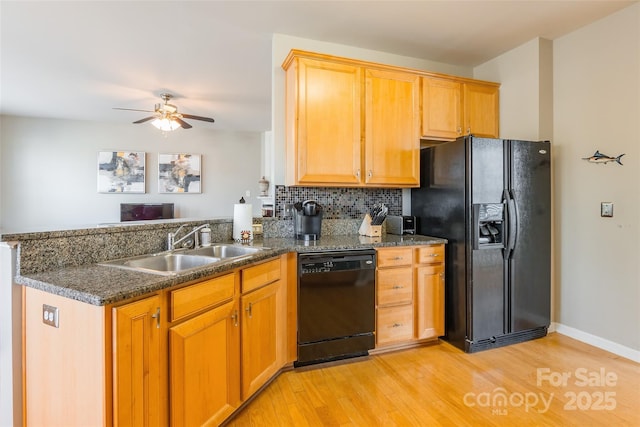7554 Coastal Way, Huntersville, NC 28078 - kitchen with a peninsula, a ceiling fan, a sink, light wood-type flooring, and black appliances