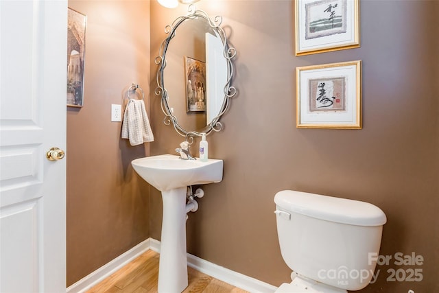 7554 Coastal Way, Huntersville, NC 28078 - bathroom featuring toilet, baseboards, and wood finished floors