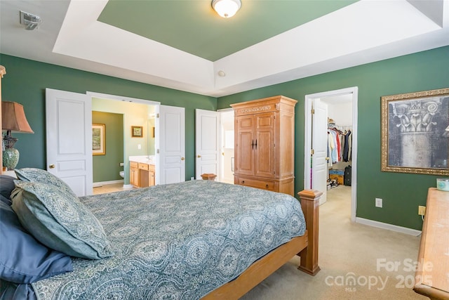 7554 Coastal Way, Huntersville, NC 28078 - bedroom featuring light carpet, baseboards, a walk in closet, and a raised ceiling