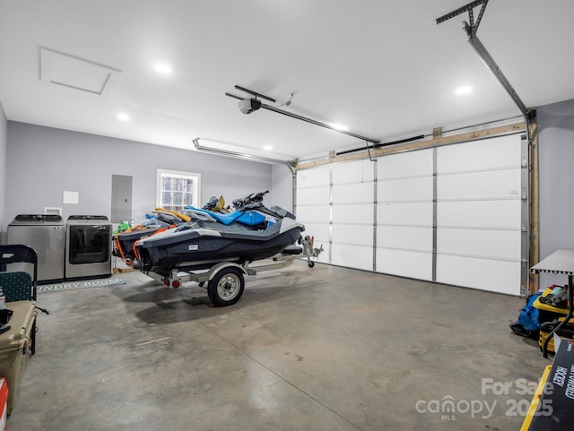 garage with washer and dryer, recessed lighting, a garage door opener, and electric panel