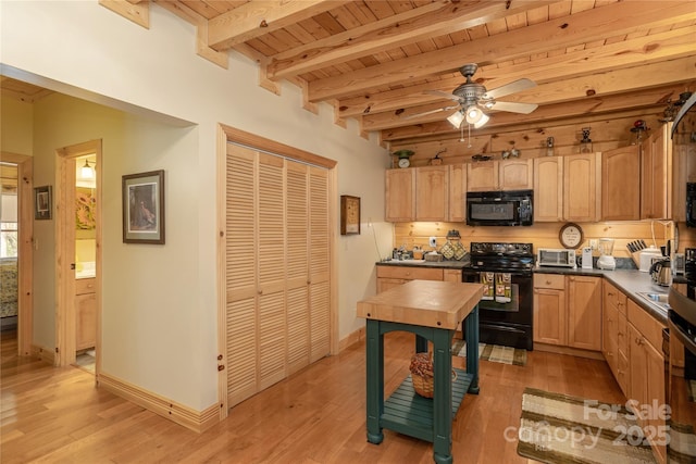 kitchen featuring light wood-style floors, ceiling fan, beamed ceiling, black appliances, and wood ceiling