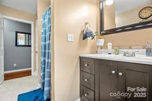 bathroom with vanity and a shower with curtain