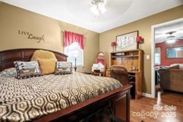 bedroom featuring wood finished floors