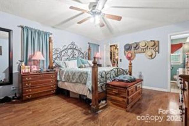 bedroom with ceiling fan and wood finished floors