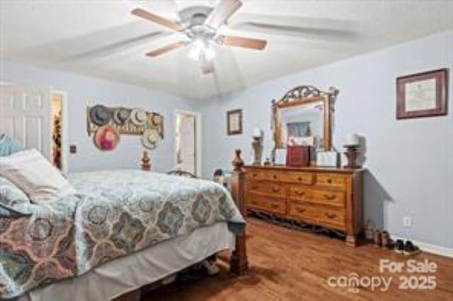 bedroom with wood finished floors and ceiling fan