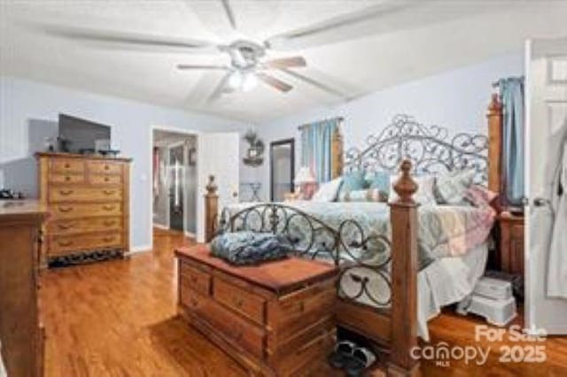 bedroom featuring ceiling fan and wood finished floors
