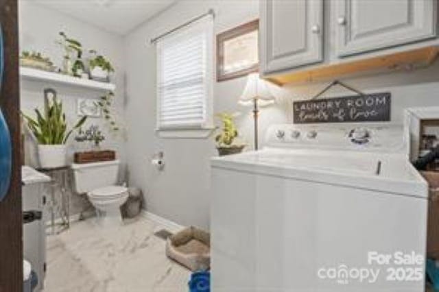 laundry room featuring washer / clothes dryer and cabinet space