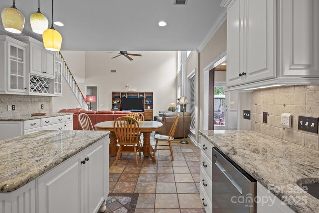 kitchen with white cabinetry, glass insert cabinets, ceiling fan, and dishwasher