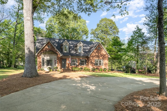 119 Lakenheath Ln, Matthews, NC 28105 - cape cod-style house featuring brick siding