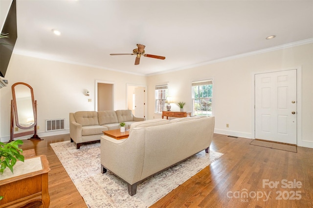 119 Lakenheath Ln, Matthews, NC 28105 - living room with visible vents, baseboards, a ceiling fan, and crown molding