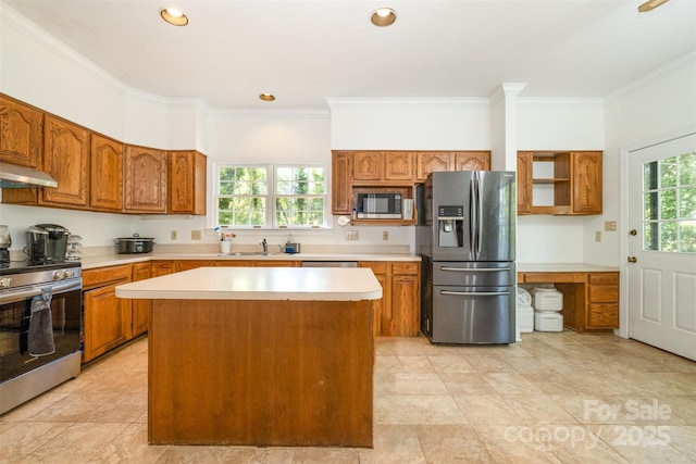 119 Lakenheath Ln, Matthews, NC 28105 - kitchen featuring brown cabinetry, crown molding, light countertops, and stainless steel appliances