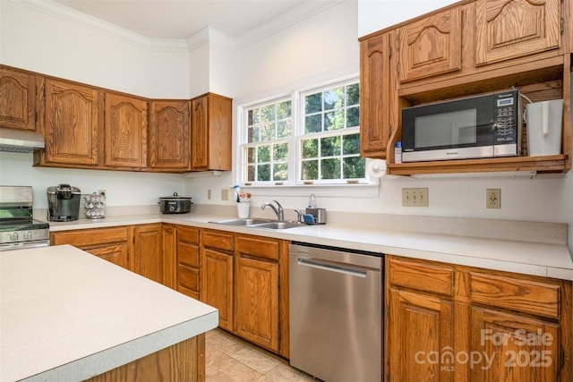 119 Lakenheath Ln, Matthews, NC 28105 - kitchen with ornamental molding, light countertops, under cabinet range hood, appliances with stainless steel finishes, and a sink