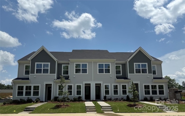 4724 Lakeview Rd Unit 26, Charlotte, NC 28216 - view of front of home with board and batten siding and a front yard