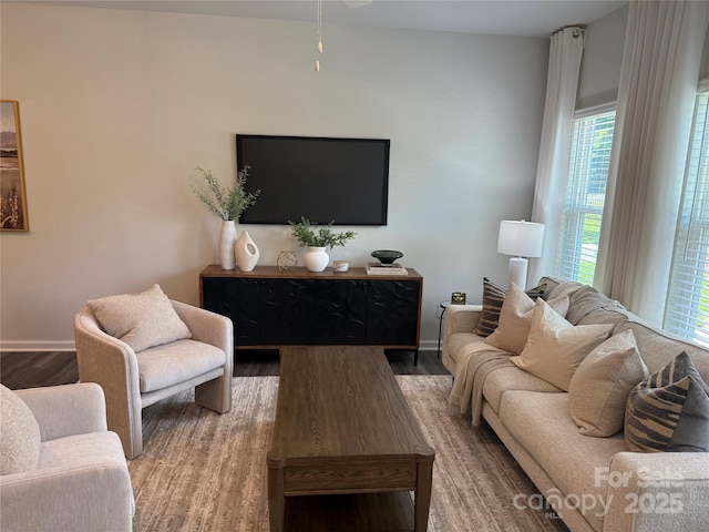 4724 Lakeview Rd Unit 26, Charlotte, NC 28216 - living room with wood finished floors, healthy amount of natural light, ceiling fan, and baseboards