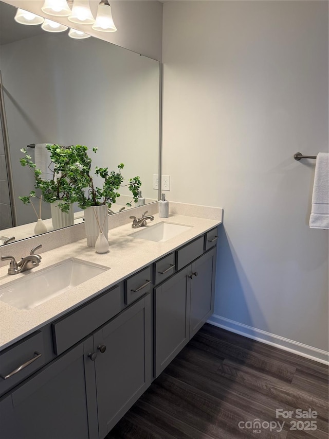 4724 Lakeview Rd Unit 26, Charlotte, NC 28216 - full bathroom with wood finished floors, double vanity, and baseboards