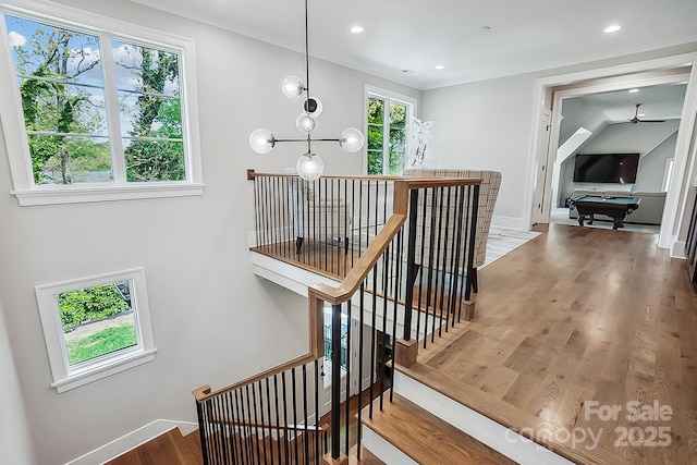 staircase featuring baseboards, wood finished floors, recessed lighting, a ceiling fan, and billiards