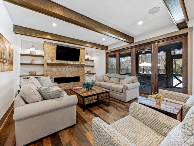 59 W Bradford Hill Rd, Mills River, NC 28759 - living room with beam ceiling, baseboards, dark wood-style floors, a large fireplace, and a ceiling fan