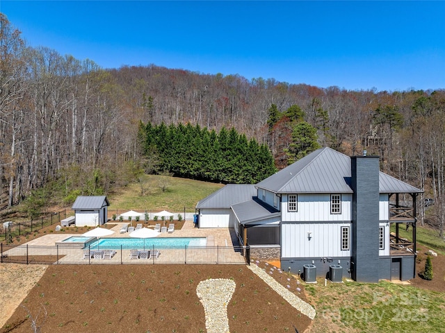 59 W Bradford Hill Rd, Mills River, NC 28759 - view of swimming pool featuring a fenced in pool, fence, a wooded view, and a patio