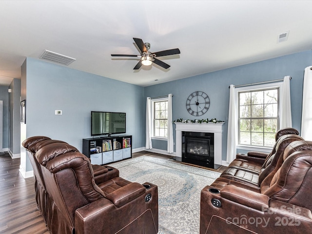 3012 Ocean Dr, Monroe, NC 28110 - living room featuring baseboards, visible vents, wood finished floors, and ceiling fan