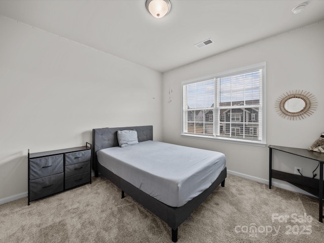 9582 Creighton Rd NW, Concord, NC 28027 - bedroom featuring light carpet, baseboards, and visible vents